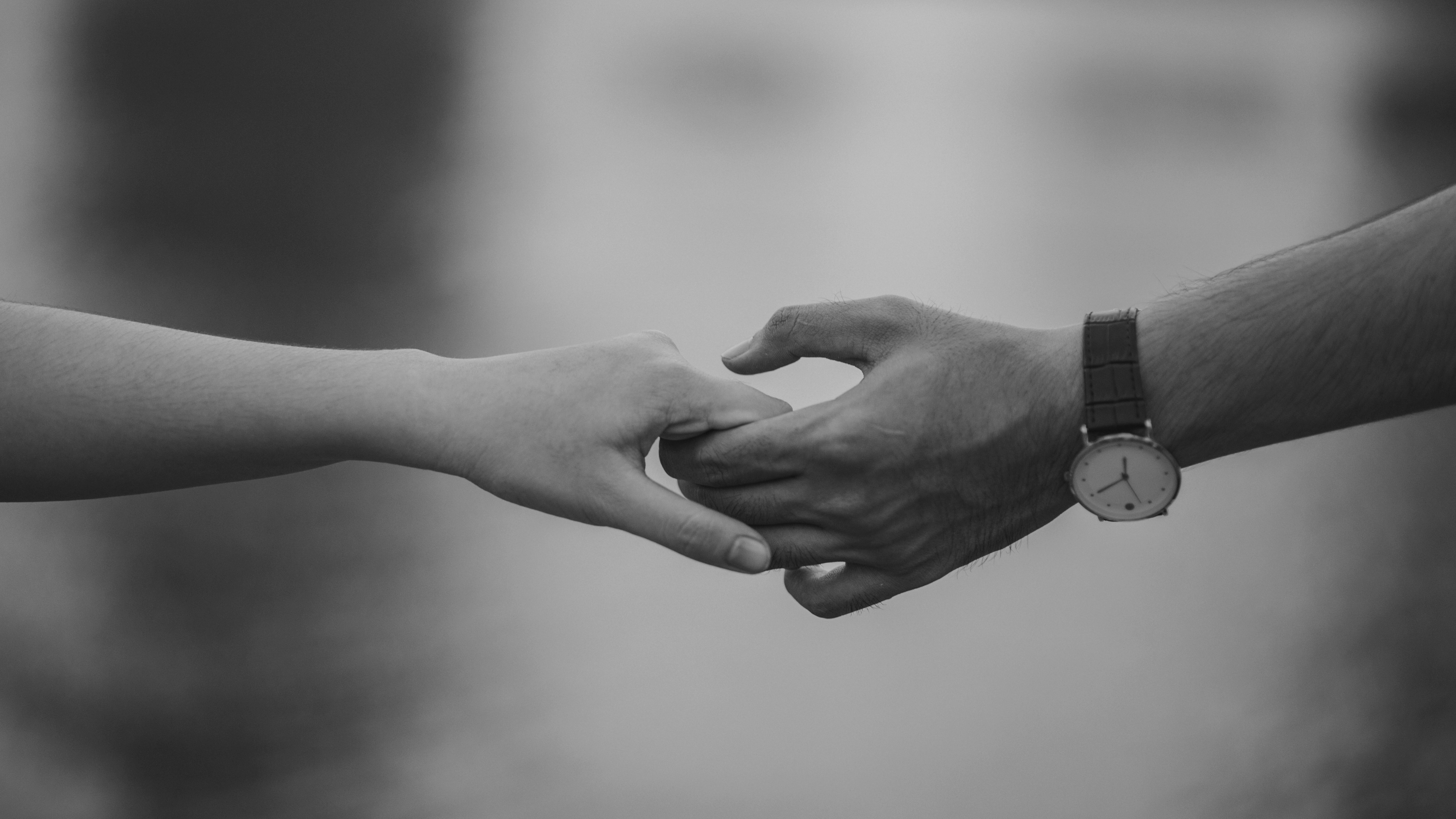 Canva - Monochrome Photo of Couple Holding Hands