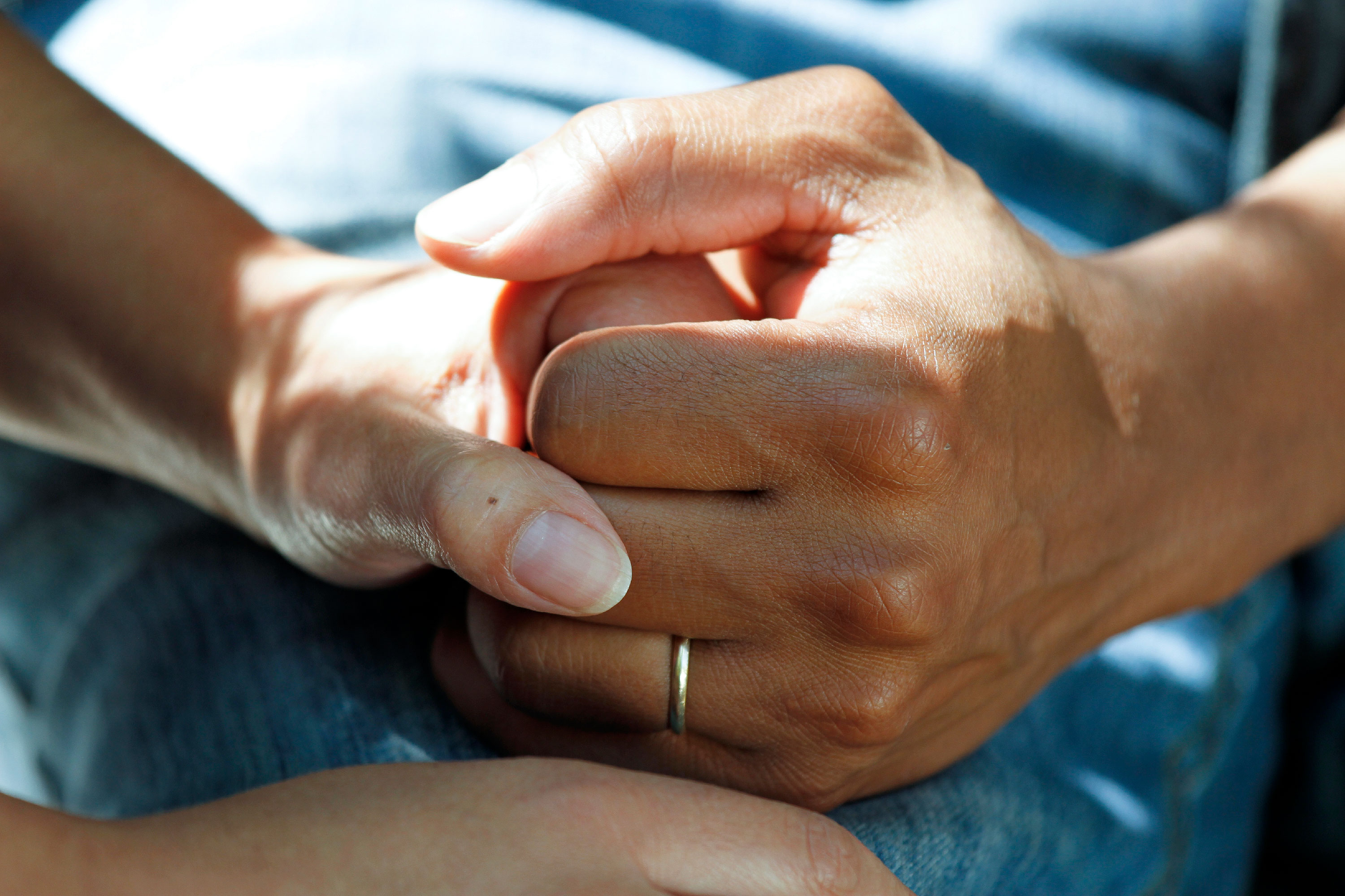 Couple clasping hands
