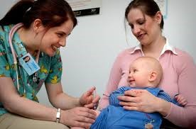 child with mother and doctor